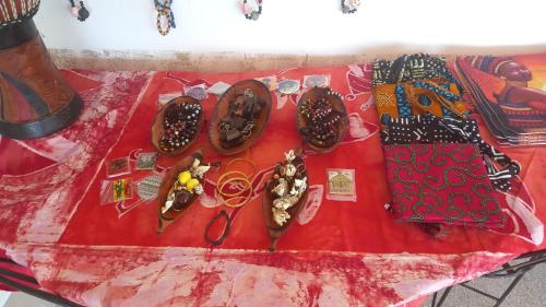 a table with shoes and other items on it at CAMPAMENTO CHEZ CAMPOS in Cap Skirring
