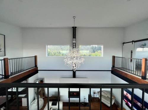 a dining room with a chandelier at The View @ Ulandi in Lowther