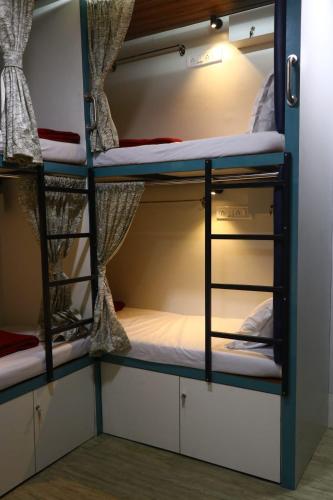 a group of bunk beds in a room at Dormitory Hub in Mumbai