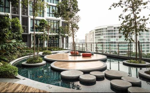 a courtyard with a fountain in a building at H20 Residence Ara Damansara Petaling Jaya in Petaling Jaya