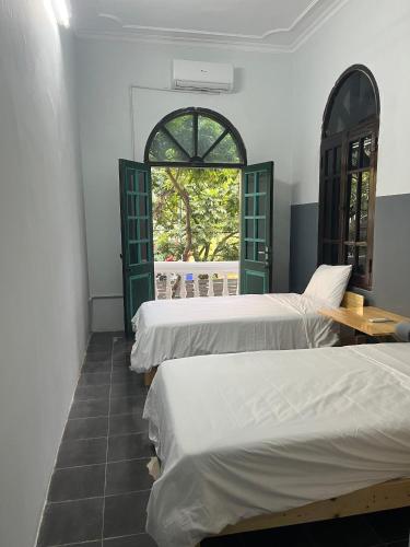 Кровать или кровати в номере Hanoi AVANA HOMESTAY LONG BIEN