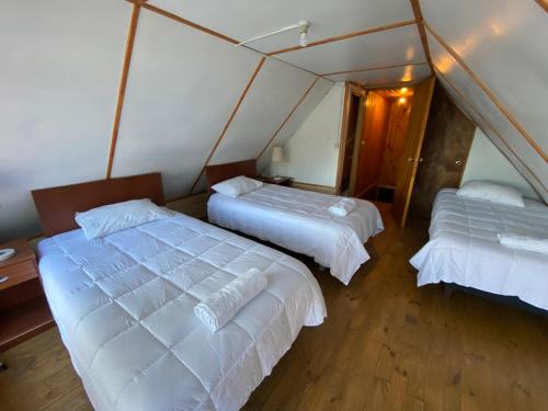 Cama ou camas em um quarto em Cabañas kavizke