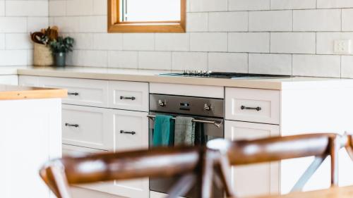 a kitchen with a stove and a counter top at Hayduke in Red Hill South