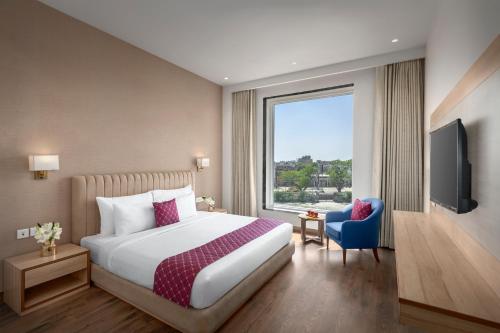 Postel nebo postele na pokoji v ubytování Palasa Hotel