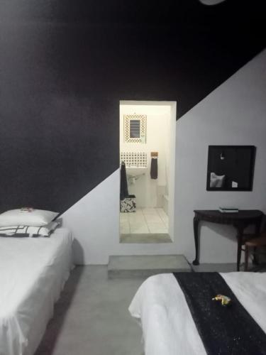 Ein Bett oder Betten in einem Zimmer der Unterkunft Prosper Stud Guest House