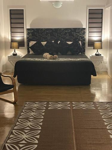 Rarotonga Villas Absolute Beachfrontにあるベッド