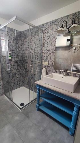 a bathroom with a shower and a sink and a shower at Apartmán Šumiac 3 in Šumiac