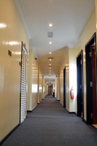 a corridor of an office building with a hallway at Hotel Meliden in Sandakan