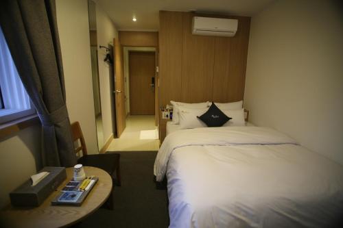 Un ou plusieurs lits dans un hébergement de l'établissement Vatica Hotel Dongdaemun
