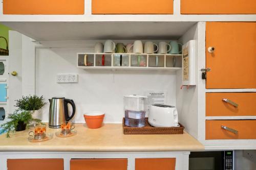 a kitchen with a counter with a blender and cups at Retro Beach Babe 100 metres to the beach in Tootgarook