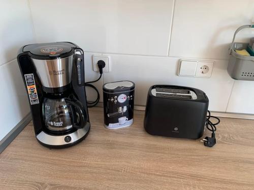 a coffee maker and a toaster on a kitchen counter at Panorama Apartment in Kandern