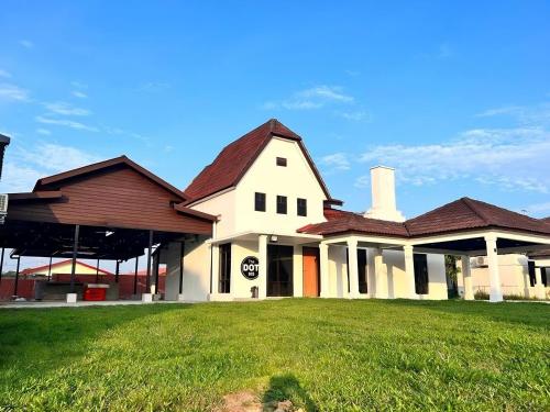 a large white house with a red roof at TheDot 903 @ A’Famosa Villa NEW VILLA in Kampong Alor Gajah