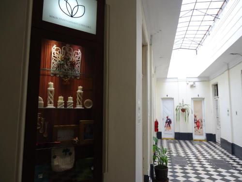 a hallway of a museum with a sign on the door at Hospedaje Santa Rosa- Centro Histórico in Lima
