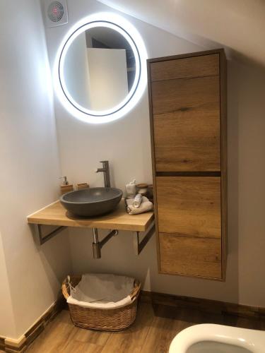 a bathroom with a sink and a mirror at Hallo Maastricht B&B Fientje in Maastricht