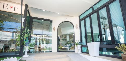 an entrance to a store with large windows at Blue Carina Hotel Phuket in Phuket Town