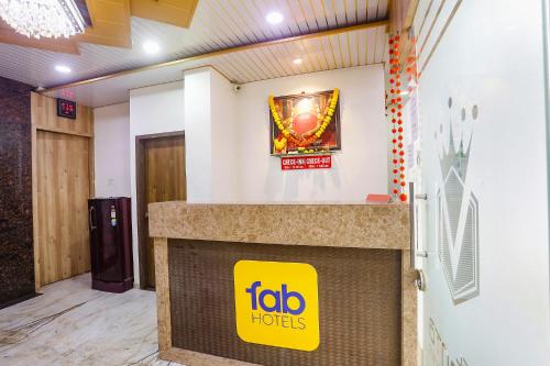 a job horizons office with a yellow sign on the wall at FabHotel Vedanta Inn in Nagpur