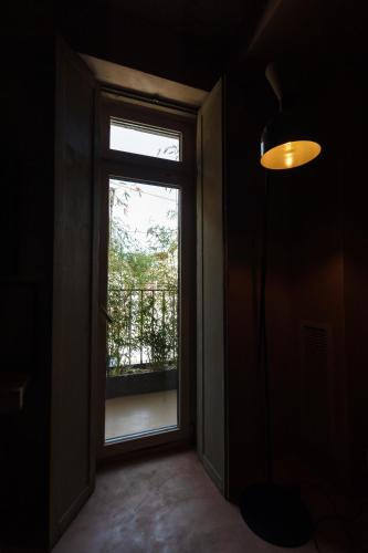 an empty room with a window and a door at Life Gallery Hotel & Spa in Korçë
