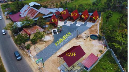 an overhead view of a building with a cafe sign at "Sakinah" Homestay Syariah AC in Sarilamak