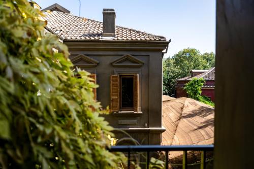 a house with a window and a roof at Life Gallery Hotel & Spa in Korçë