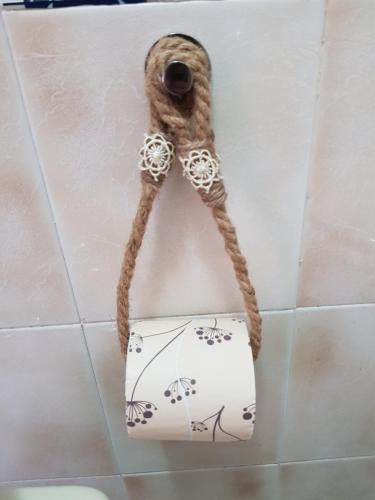 a pipe hanging from a wall in a bathroom at La Tana degli Orsetti in Barrea