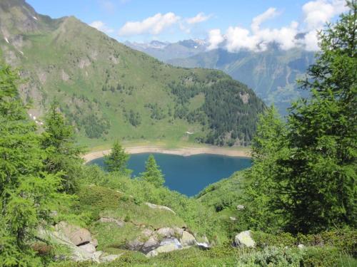a blue lake in the middle of a mountain at Appartamento Evelina in Airolo