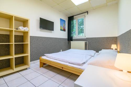 Ein Bett oder Betten in einem Zimmer der Unterkunft Hostel Seven