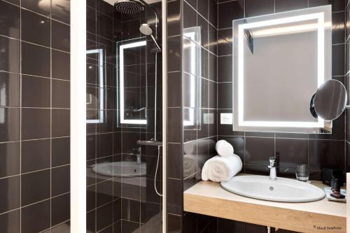 two pictures of a bathroom with a sink and a shower at Aiden by Best Western T'aim Hotel & SPA in Compiègne