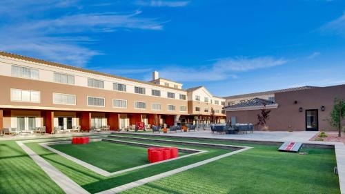 a large building with a lawn in front of it at Aiden by Best Western Scottsdale North in Scottsdale