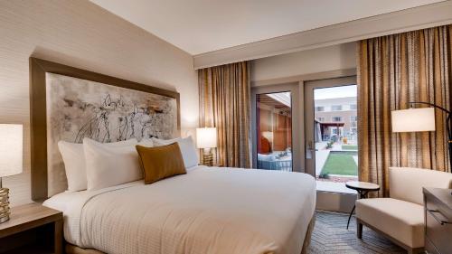 a hotel room with a bed and a window at Aiden by Best Western Scottsdale North in Scottsdale