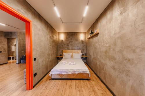 a bedroom with a bed in a room at 2х Комнатная фирменная квартира №1 в Петропавловске in Petropavlovsk