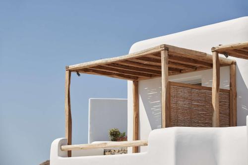 a view from the balcony of a house at Radisson Blu Euphoria Resort, Mykonos in Kalo Livadi