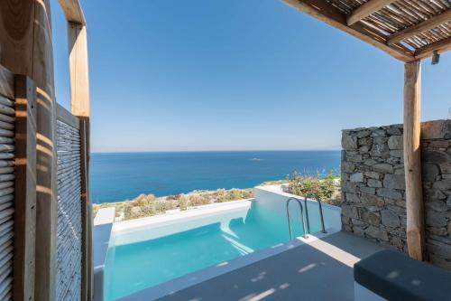 a view of the ocean from the balcony of a villa at Radisson Blu Euphoria Resort, Mykonos in Kalo Livadi