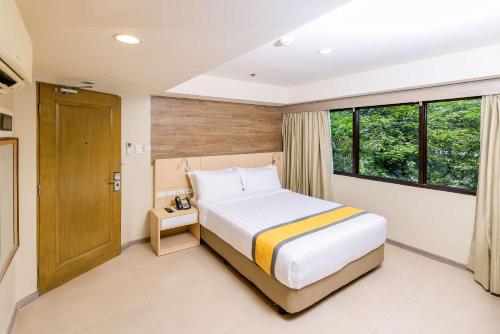 Voodi või voodid majutusasutuse SureStay Plus by Best Western Cebu City toas