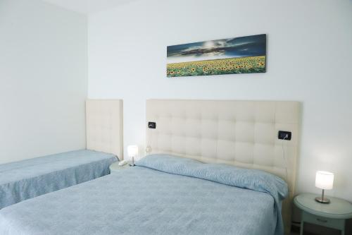 Posteľ alebo postele v izbe v ubytovaní Hotel La Bussola