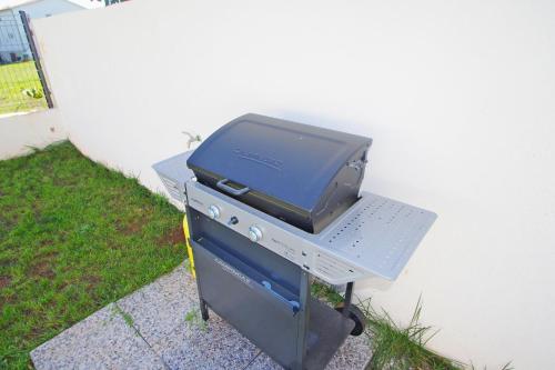 a grill with a television on top of it at Holiday house with private pool in village Šišan in Šišan