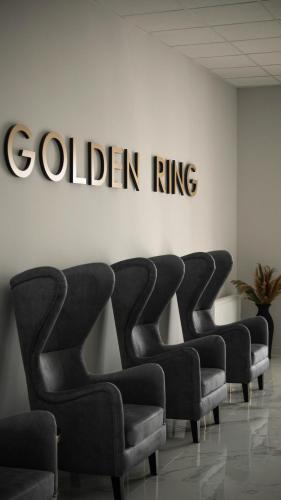 a row of chairs in a waiting room with the golden ring sign at GOLDEN RING in Ternopilʼ