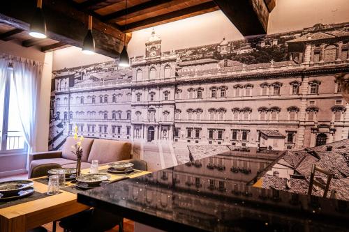 a dining room with a mural of a building at Old Town - Boutique Rooms in Modena