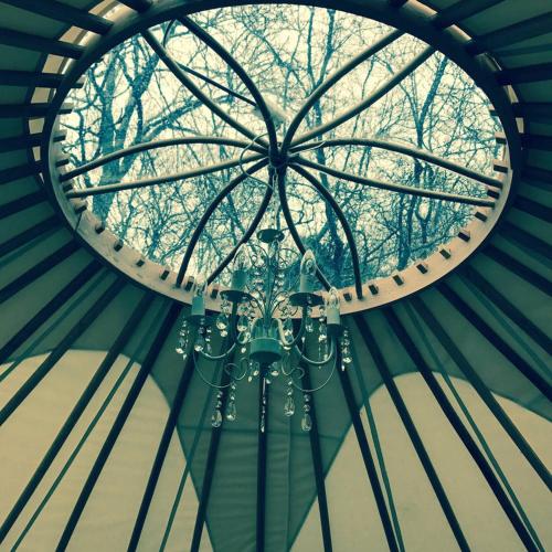 a chandelier hanging from the ceiling of a building at Luxury Yurts in Michaelchurch Escley