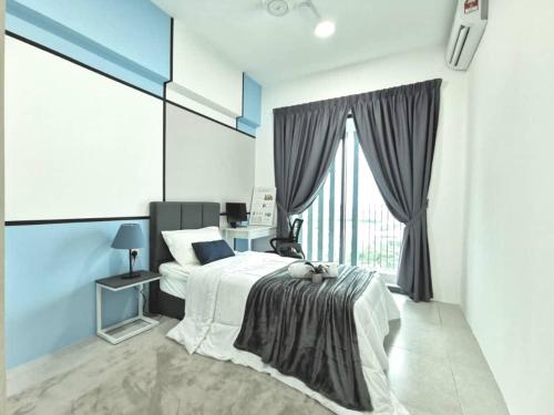 a bedroom with a bed and a large window at Meritus Service Apartment in Perai