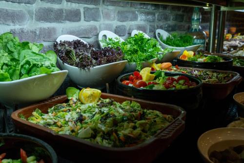 a bunch of bowls of vegetables on a table at Laren Family Hotel & Spa - Boutique Class in Antalya