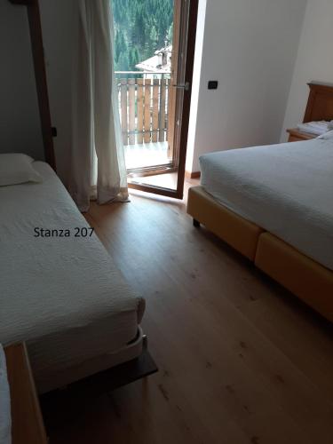 Postel nebo postele na pokoji v ubytování Hotel Pizboè