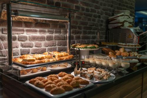 a bakery with many different types of pastries on display at Laren Family Hotel & Spa - Boutique Class in Antalya