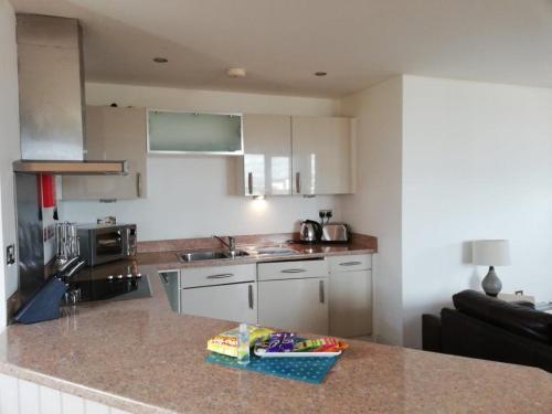A kitchen or kitchenette at Pelican House is an exclusive contemporary development