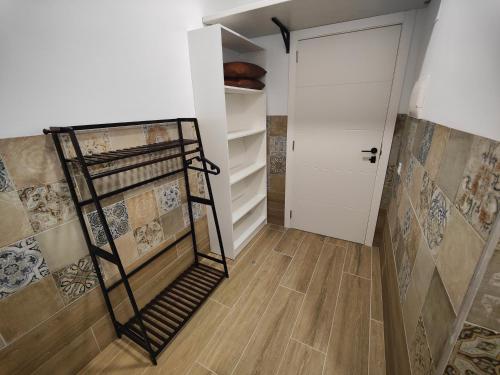 a room with a walk in closet and a door at РUEВLO МAR, hotel-apartamento in Calpe