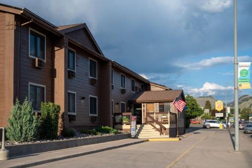 a building on the corner of a street at Super 8 by Wyndham Gardiner/Yellowstone Park Area in Gardiner