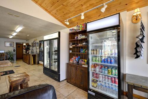 a store with a refrigerator with drinks in it at Super 8 by Wyndham Gardiner/Yellowstone Park Area in Gardiner