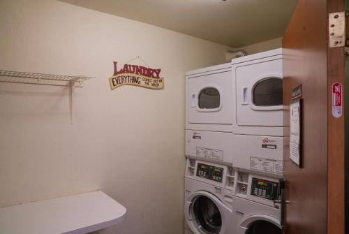 a laundry room with a washer and dryer at Super 8 by Wyndham Yuma in Yuma