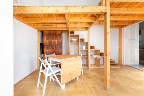 a room with a desk and a loft bed at V26 Freedom Lodge Apartment in Budapest