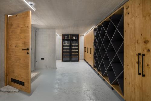 an empty wine cellar with wooden cabinets and wine racks at Villa Calvia Crispinilla in Novigrad Istria