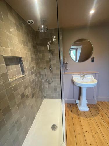 a bathroom with a shower and a sink at Holbrook Manor & Spa in Wincanton